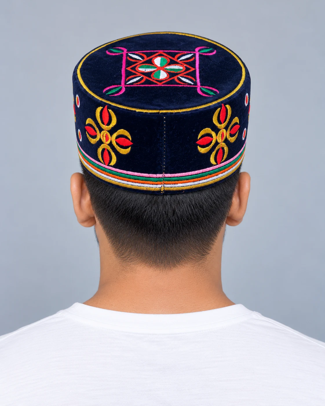 Embroidered Velvet Tamang Topi for Men 15 Man wearing navy blue embroidered velvet topi back view