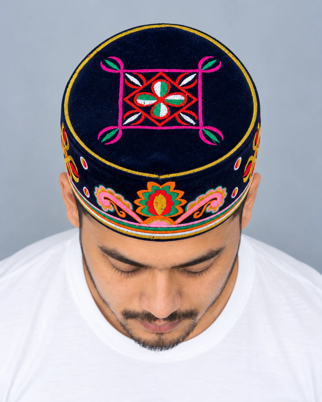 Embroidered Velvet Tamang Topi for Men 16 Man wearing navy blue embroidered velvet topi top view