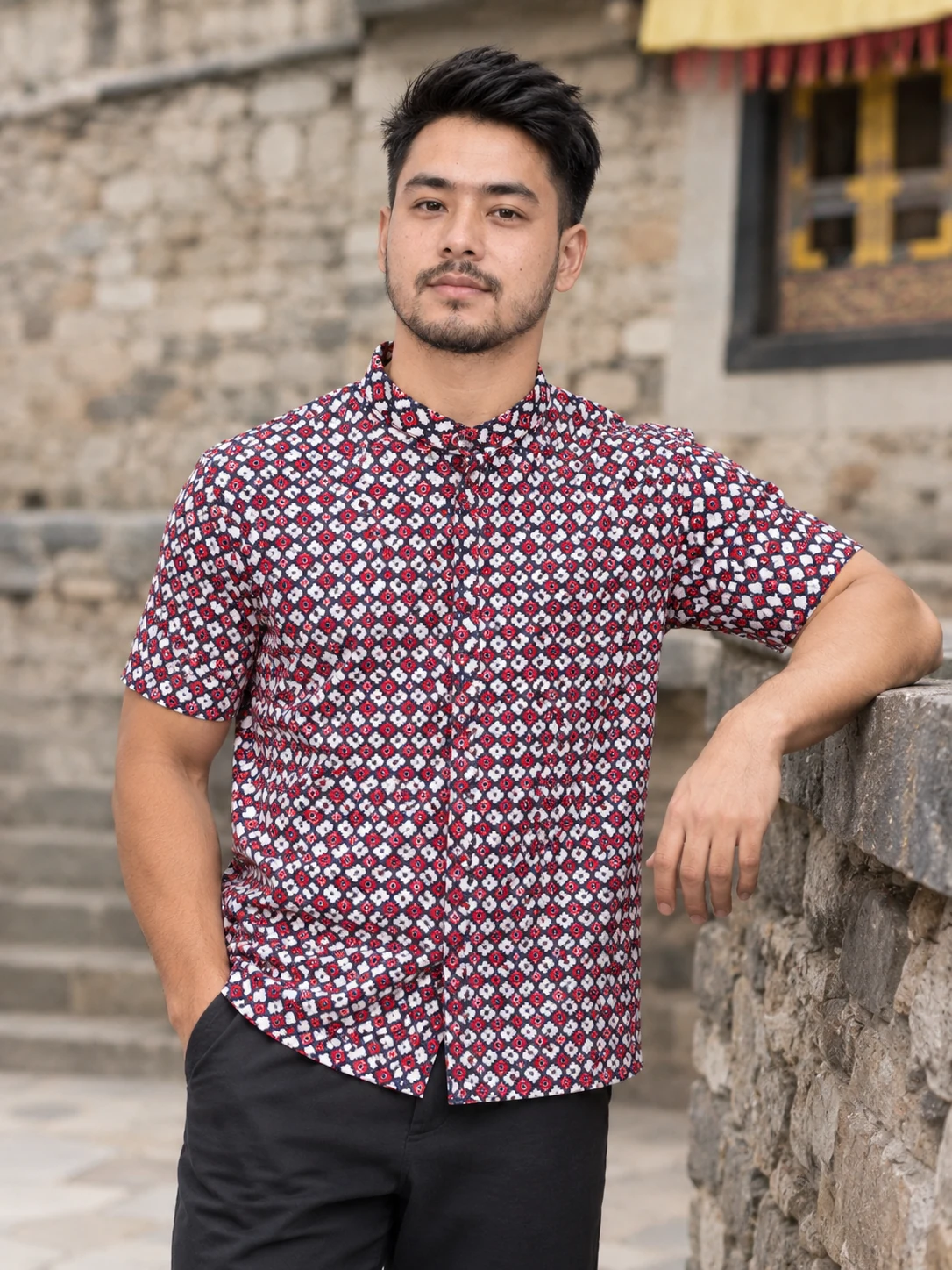 Half Sleeve Nepali Shirt for Men in Dhaka Print Cotton 1 Man wearing red and navy dhaka print half sleeve nepali shirt front view