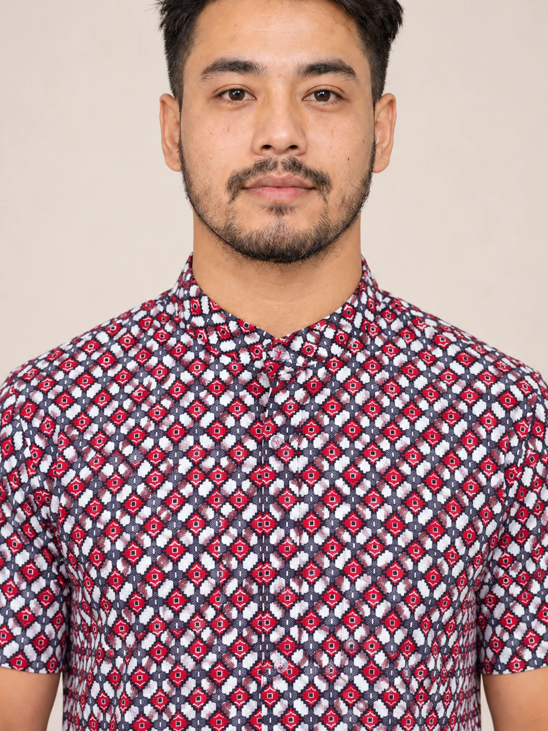 Half Sleeve Nepali Shirt for Men in Dhaka Print Cotton 6 Man wearing red and navy dhaka print short sleeve shirt collar and placket close up