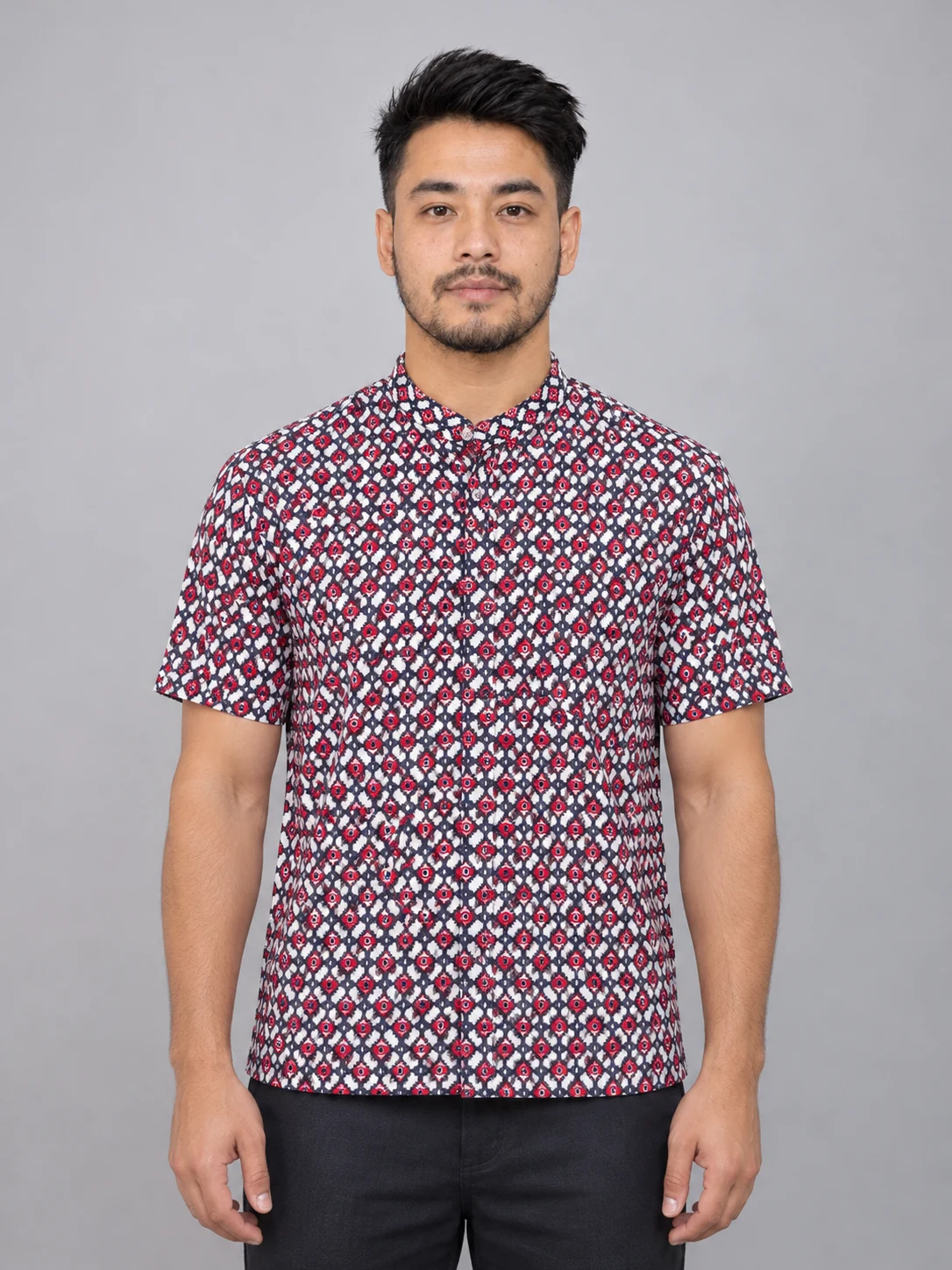 Half Sleeve Nepali Shirt for Men in Dhaka Print Cotton 2 Man wearing red and navy dhaka print short sleeve shirt front view studio