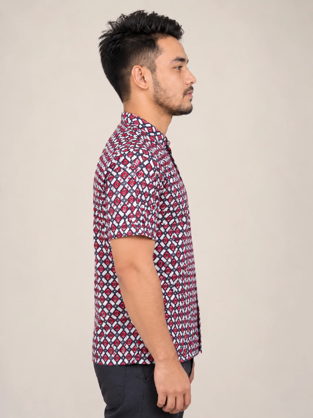 Half Sleeve Nepali Shirt for Men in Dhaka Print Cotton 4 Man wearing red and navy dhaka print short sleeve shirt side view