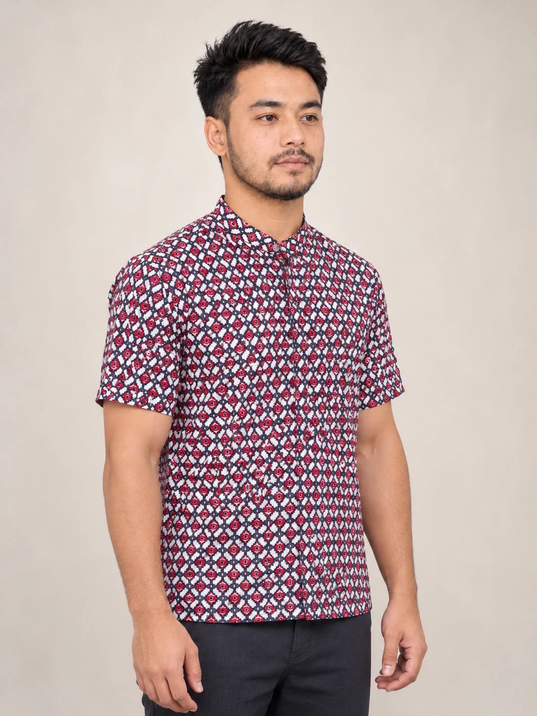Half Sleeve Nepali Shirt for Men in Dhaka Print Cotton 3 Man wearing red and navy dhaka print short sleeve shirt three quarter view