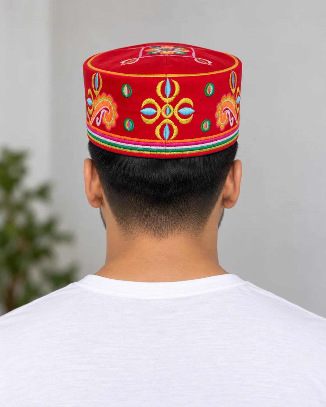 Embroidered Velvet Tamang Topi for Men 21 Man wearing red embroidered velvet topi back view