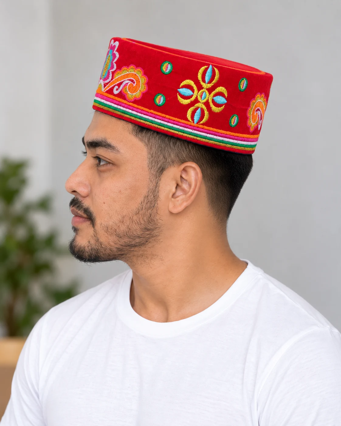Embroidered Velvet Tamang Topi for Men 20 Man wearing red embroidered velvet topi side view