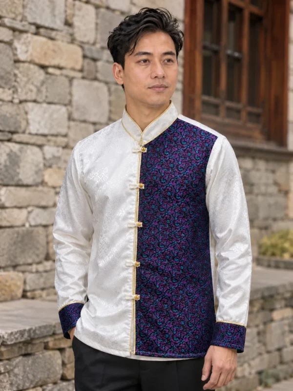 Man wearing white and navy brocade khenja front view outdoors