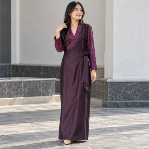 Woman wearing bhutia dress in plum suiting with floral honju sleeves front view