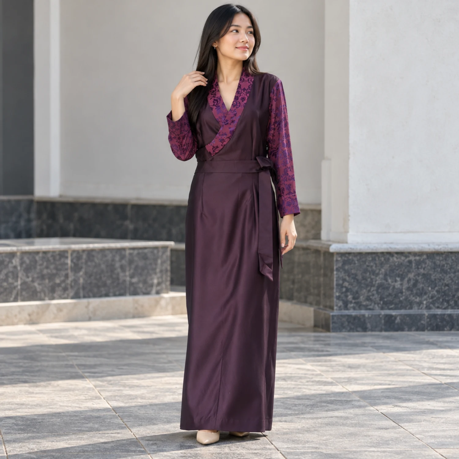 Bhutia Bakhu Dress with Floral Honju Sleeves 1 Woman wearing bhutia dress in plum suiting with floral honju sleeves front view