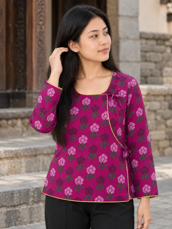 Woman wearing magenta nepali cholo for women laliguras print scoop neck wrap front view