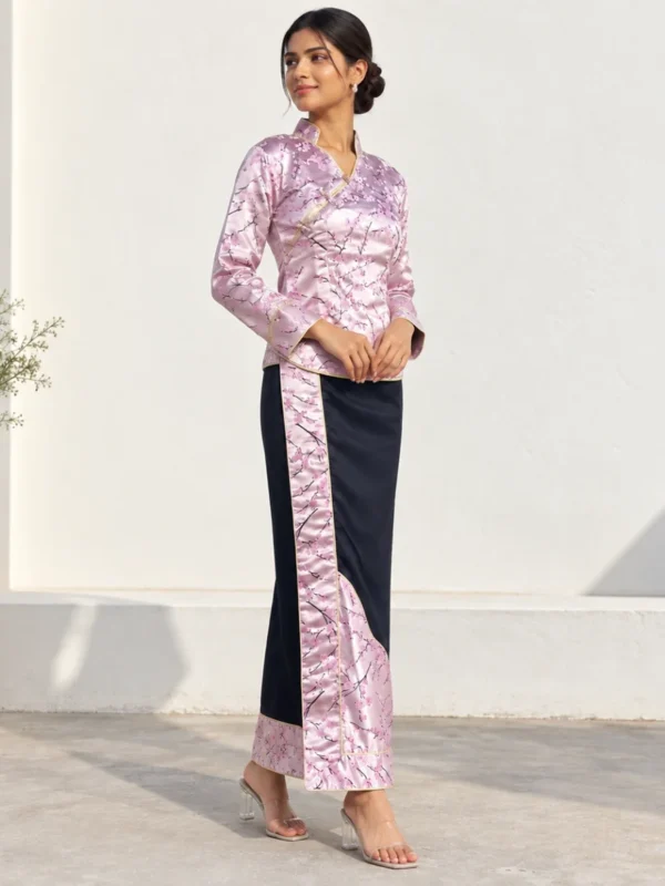 Woman wearing pink brocade tamang wrapper set front view