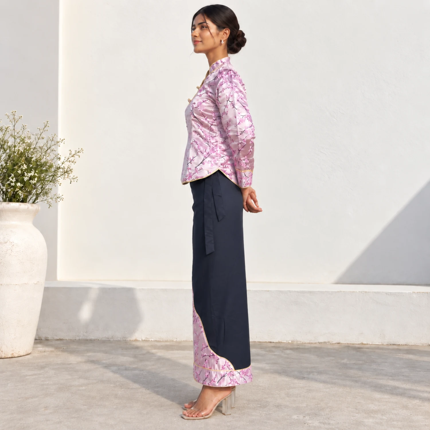 Brocade Tamang Wrapper Set — Wrap Top & Phariya Skirt 3 Woman wearing Pink brocade wrap top and phariya skirt side view