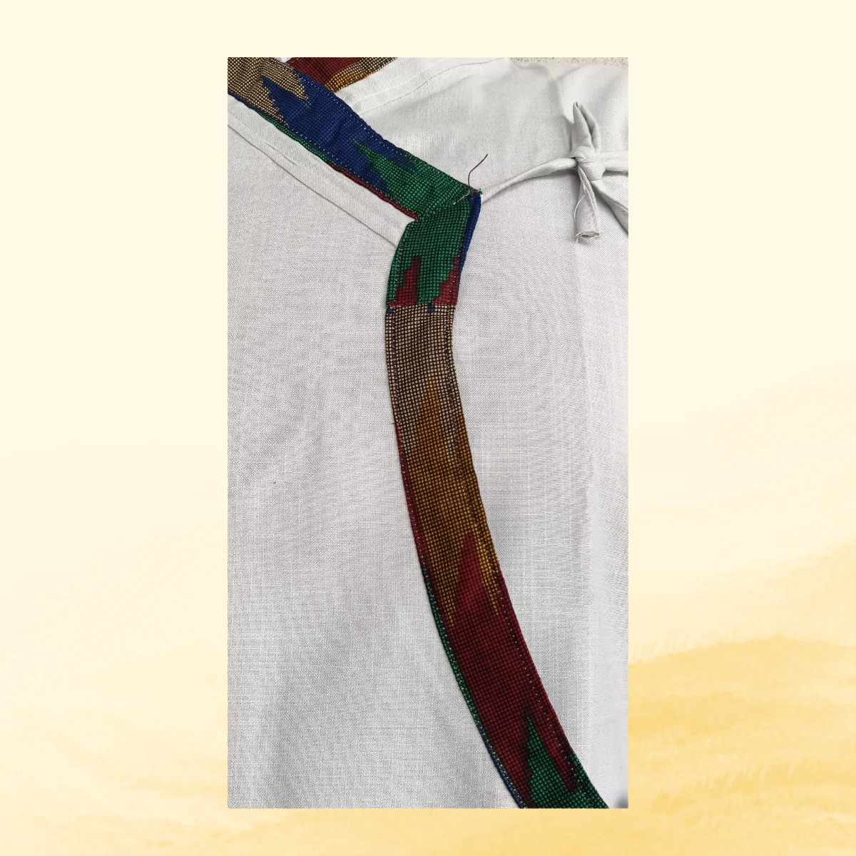 Close-up of Dhaka patterned border on white cotton Daura Close-up of Dhaka patterned border on white cotton Daura