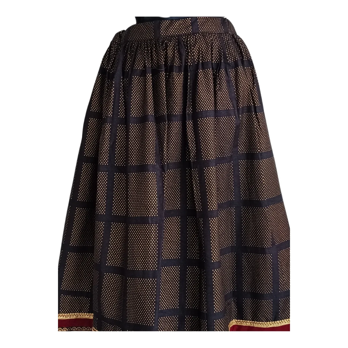 Close-up of black grid checks and gold micro-dot texture on cotton lehenga