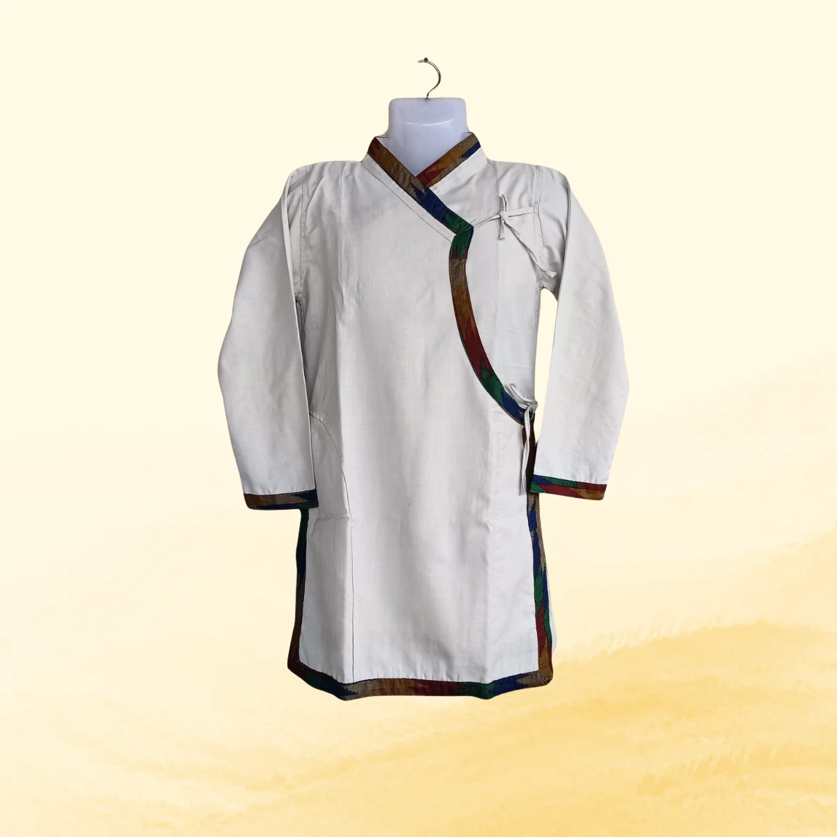 White Daura top with multicolour Dhaka trim and tie knots White Daura top with multicolour Dhaka trim and tie knots