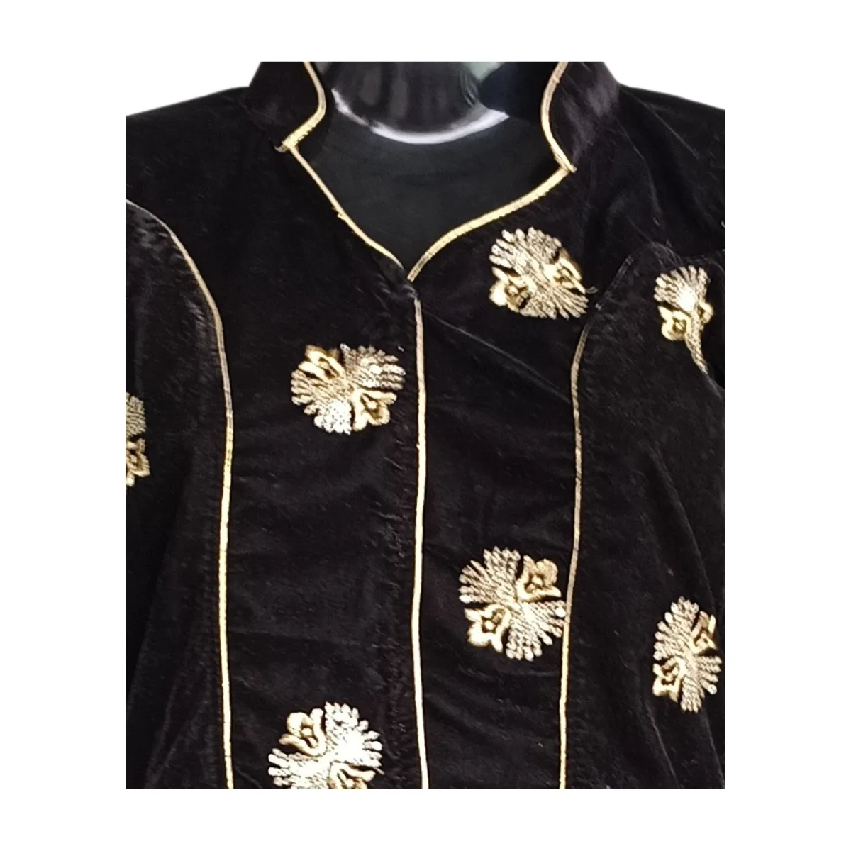 Detail of black velvet blouse showing clustered gold embroidery and piping
